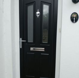 Upvc black door with white outer frame made to mimic a composite door: Click Here To View Larger Image