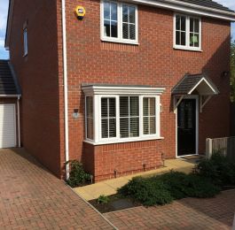 Black composite door and windows with cruciform Georgian bars: Click Here To View Larger Image