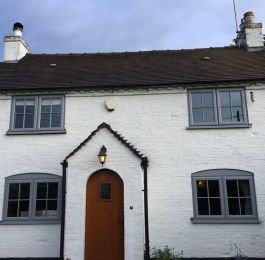 Silver grey upvc windows with cruciform astragal bars: Click Here To View Larger Image
