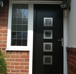 Upvc door and side flag window with white outer frame and anthracite grey door sash and infill panel: Click Here To View Larger Image
