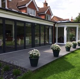 Two anthracite grey Bi Folding doors with a joining pillar.: Click Here To View Larger Image